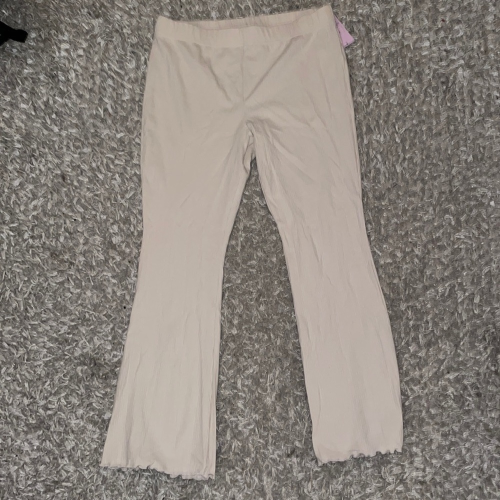Target cream vertically lined flare pant, frills on end of pants